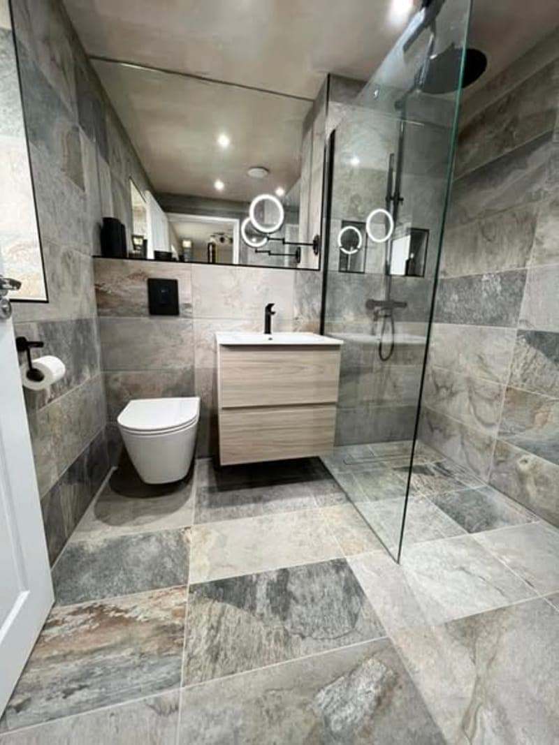 A slate tiled wet room seen from the doorway